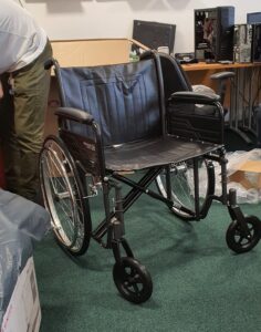 a brand new wheelchair, fresh out of the box.