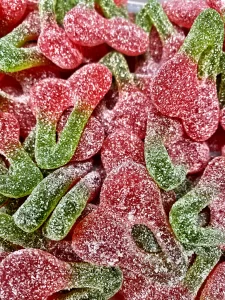 red and green sugar coated sour cherries