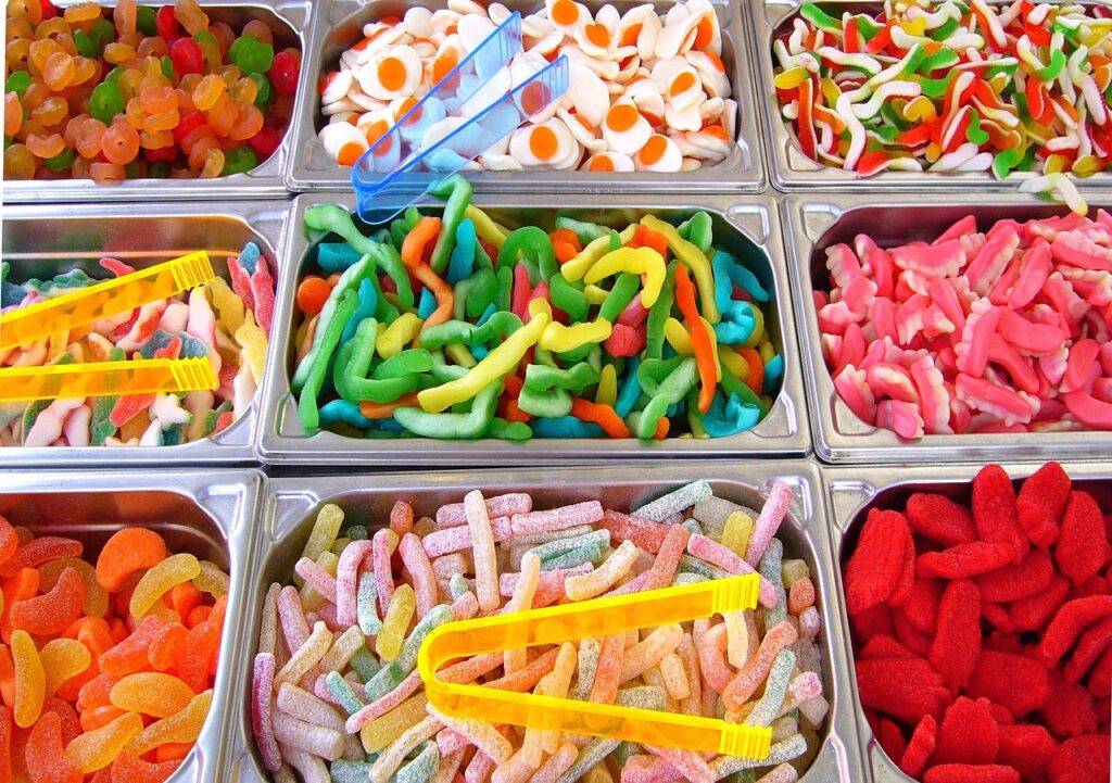 a selection of colourful sweets in individual bins