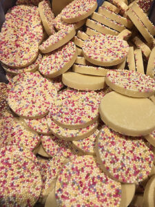 White Chocolate discs covered in multicoloured sugar beads